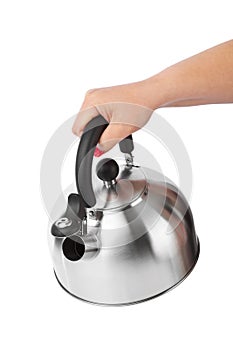 Stovetop whistling kettle in hand