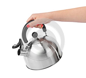 Stovetop whistling kettle in hand