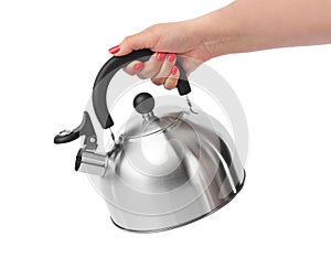 Stovetop whistling kettle in hand photo