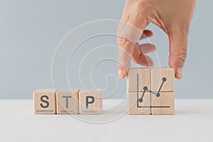 STP text ,abbreviation for Segmentation, Targeting, Positioning, on wooden cube blocks. For marketing analysis, customer target,