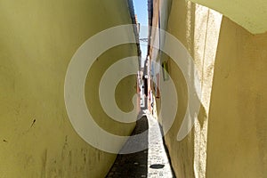 `Strada Sforii` - colorful Rope Street in Brasov city, Transylvania, Romania, one of the narrowest streets in Europe