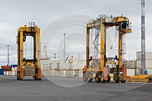 Straddle carriers in a busy port photo