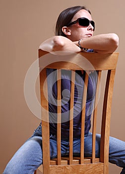 Straddling a chair photo