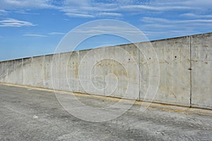 Straight concrete border or prison wall