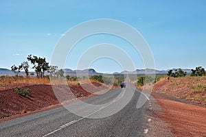 Straight desert road with camper van in Northern Territories, Australia