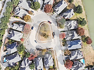 Straight down top view of lakeside residential neighborhood with