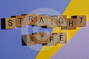 Straight Fire, words in wooden alphabet letters isolated on colourful background