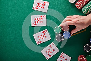 A straight flush, laid out on the table and a lot of chips. Poker, Casino, Winning combination. Player raises bets and wins