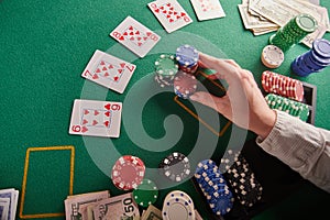 A straight flush, laid out on the table and a lot of chips. Poker, Casino, Winning combination. Player raises bets and wins