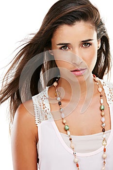 Straight forward beauty. Studio portrait of an attractive young woman posing against a white background.