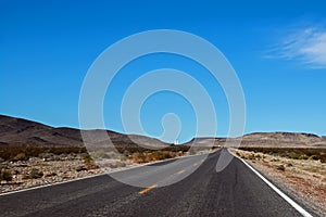 Straight highway through a desert area