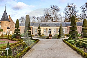 Straight path in French garden with central fountain in Alden Biesen Castle
