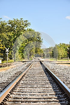 Straight railroad tracks disappearing in the distance