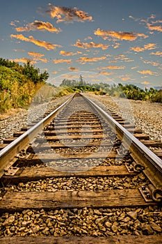 Straight Railroad Tracks at Dusk