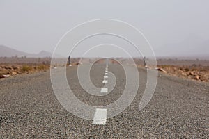 Straight road through the desert in Morocco, Africa