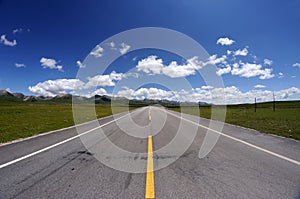 Straight road under blue sky