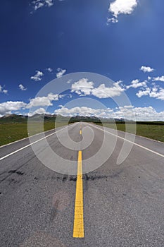 Straight road under blue sky