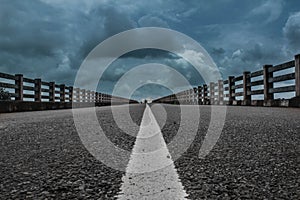 Straight road white line and cloudy sky background