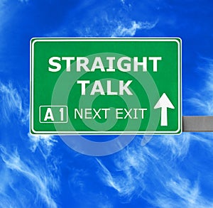 STRAIGHT TALK road sign against clear blue sky