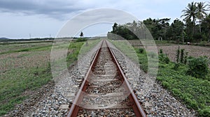 straight train tracks. horizontal iron. transportation. railroad gravel. view of the railroad. straight object.