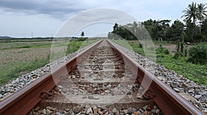 straight train tracks. horizontal iron. transportation. railroad gravel. view of the railroad. straight object.

?