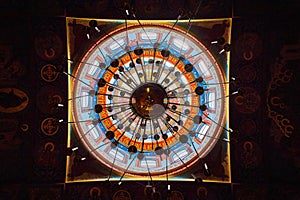 Straight up view of chandelier and domed roof of Russian Orthodox Holy Virgin Cathedral