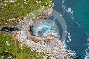 Straight view down above the holes of Jesters bufones of arenillas, Spain near city Llanes in August 2023