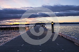 Straight view of a pier on a lake in a winter sunset at Waverly Beach Park, Kirkland, Washington