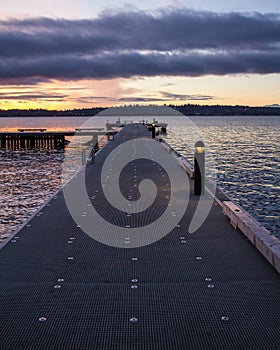 A straight view of a pier on a lake in a winter sunset at Waverly Beach Park, Kirkland, Washington