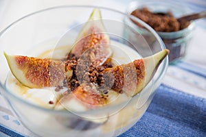 Strained yogurt with sliced figs and honey