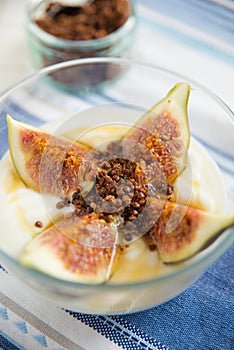 Strained yogurt with sliced figs and honey