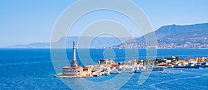 The Strait of Messina between Sicily and Italy. View from Messina town with golden statue of Madonna della Lettera and