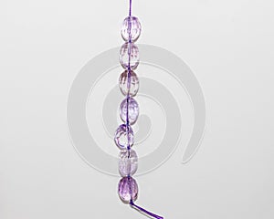 Strand of large oblong faceted purple beads