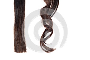 A strand of straight hair and curl on white isolate photo