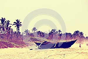 A stranded boat on a beach in goa in India