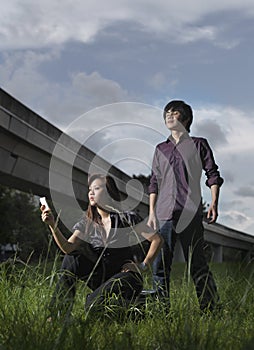 Stranded picture of Asian Couple posing outdoors