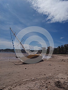 Stranded sailboat on beach