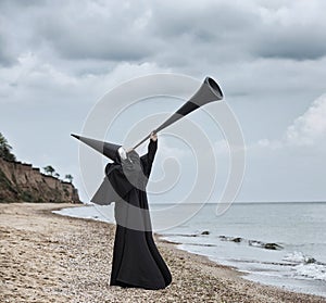 Strange figure in black cloak with the mirror face.