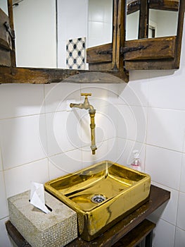 A Strange gold plated tap and sink in a cafe in Mijas in the Alpujarra Mountains above the costa del Sol