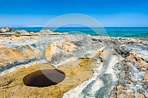 Strange hole on the beach of Malia. Crete island, Greece