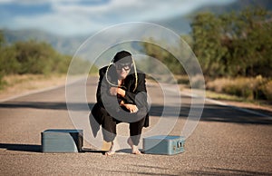 Strange indigenous man in the middle of a road