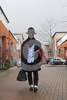 Strange man wearing black coat