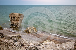 A strange stone in a beautiful green sea