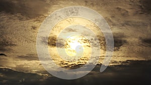 Strange sun beyond the clouds