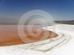 Strange view of Urmia Salt Lake. The salty beach and its red water