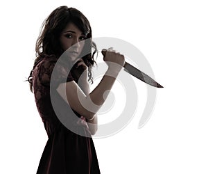 Strange young woman killer holding bloody knife silhouette