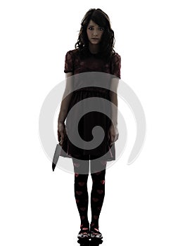 Strange young woman killer holding bloody knife silhouette