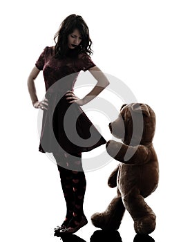 Strange young woman and vicious teddy bear silhouette