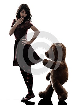 Strange young woman and vicious teddy bear silhouette