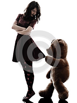 Strange young woman and vicious teddy bear silhouette